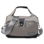 Women's handbag with shoulder strap and multiple compartments