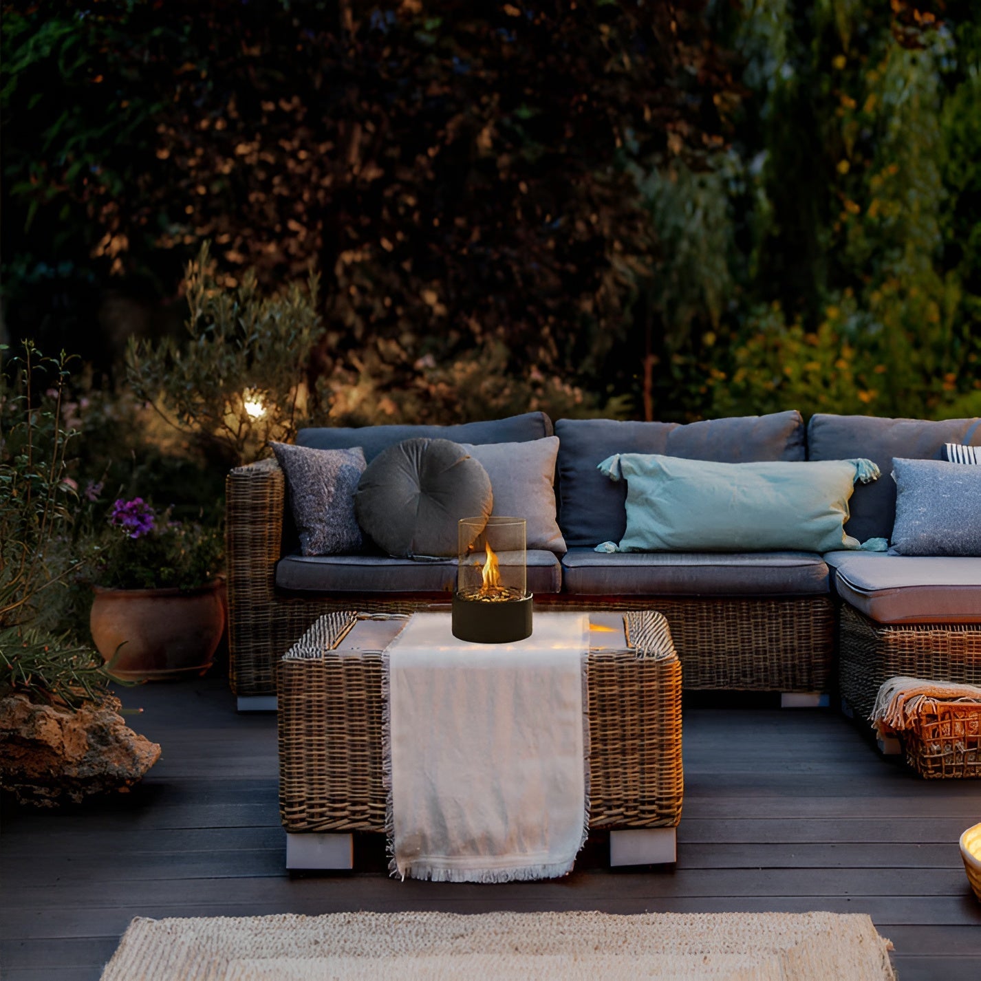 Table fireplace with glass cylinder and metal base
