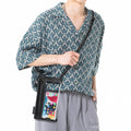 Waterproof smartphone shoulder bag with touchscreen window