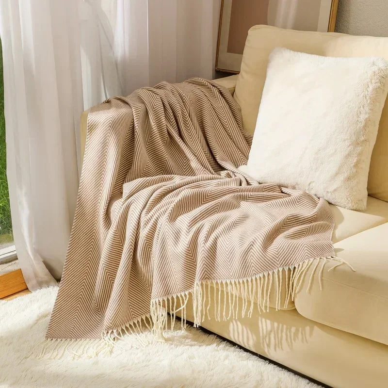 Cotton sofa throw with striped pattern and fringes
