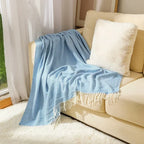 Cotton sofa throw with striped pattern and fringes