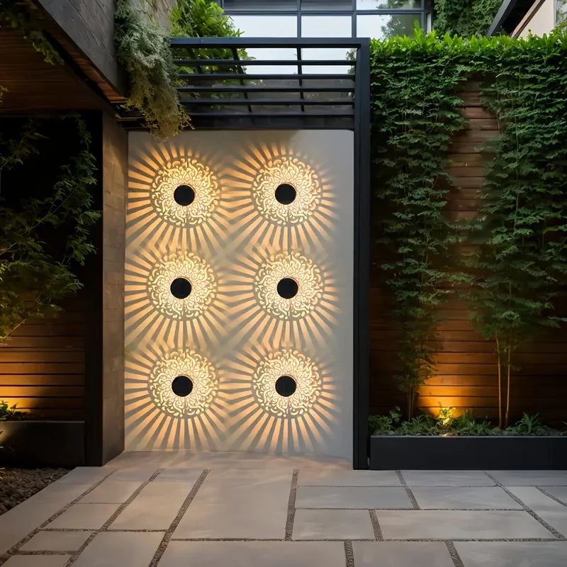 Solar lantern with decorative shadow pattern