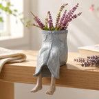 Blumentopf sitzende Beine Figur Deko