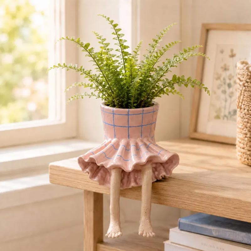 Blumentopf sitzende Beine Figur Deko