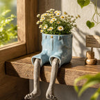 Blumentopf sitzende Beine Figur Deko