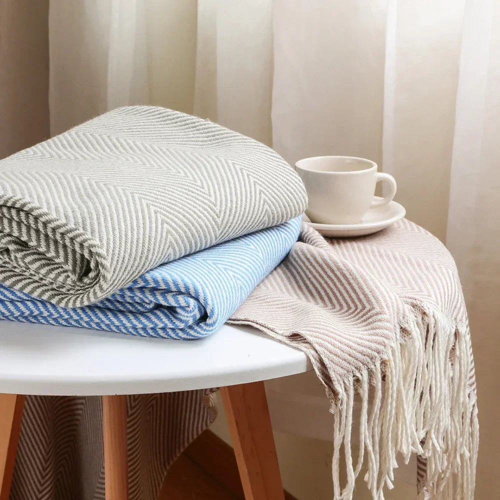 Cotton sofa throw with striped pattern and fringes