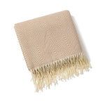 Cotton sofa throw with striped pattern and fringes