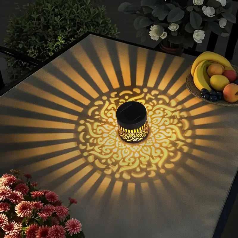 Solar lantern with decorative shadow pattern