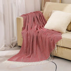 Cotton sofa throw with striped pattern and fringes
