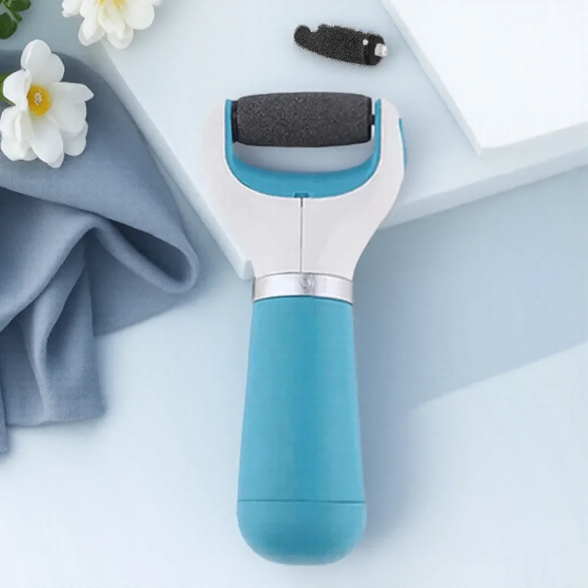 Electric callus remover with replaceable grinding heads