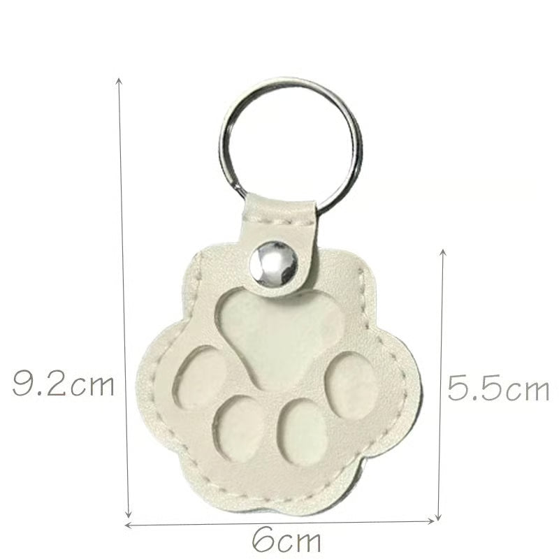Leather paw keychain with storage compartment
