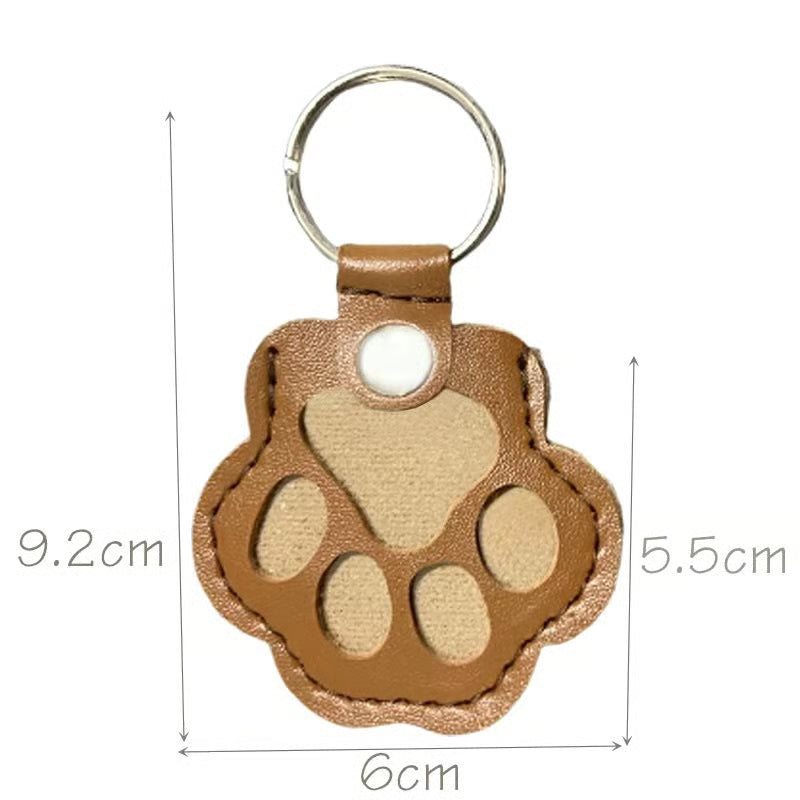 Leather paw keychain with storage compartment