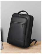 Leather backpack with USB charging port for 15.6-inch laptop