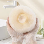 Shower sponge with massage knobs and ergonomic handle