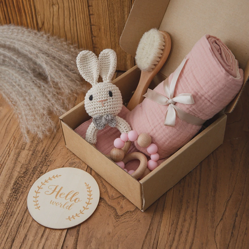 Baby gift box with muslin blanket and crocheted toy