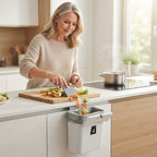 Hanging kitchen trash bin with lid for cabinet doors