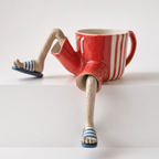 Blumentopf sitzende Beine Figur Deko