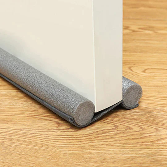 Door seal against drafts with double protection