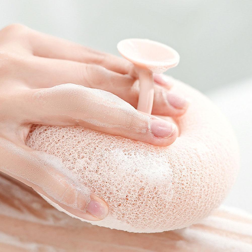 Shower sponge with massage particles and handle