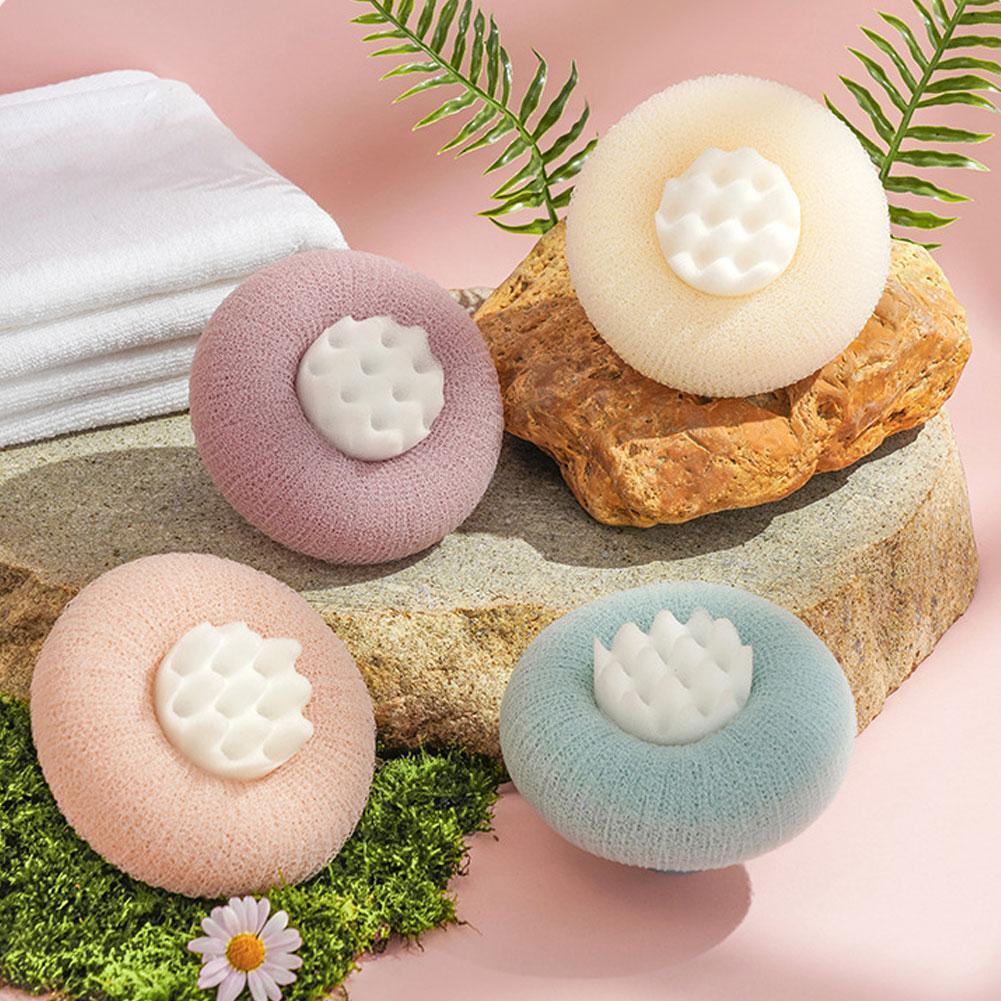 Shower sponge with massage particles and handle