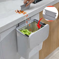 Hanging kitchen trash bin with lid for cabinet doors