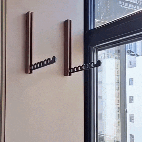 Foldable wall-mounted wooden coat rack with a space-saving design