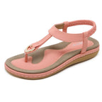 Toe separator sandals with elastic strap