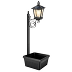 Solar plant light with integrated flower pot – warm white light