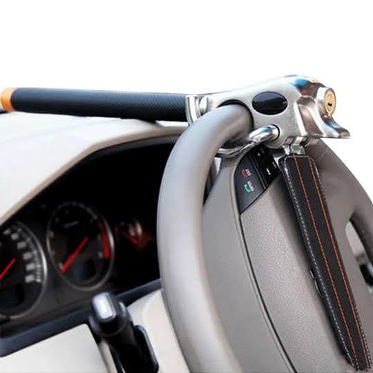 Steering wheel lock with triple locking mechanism