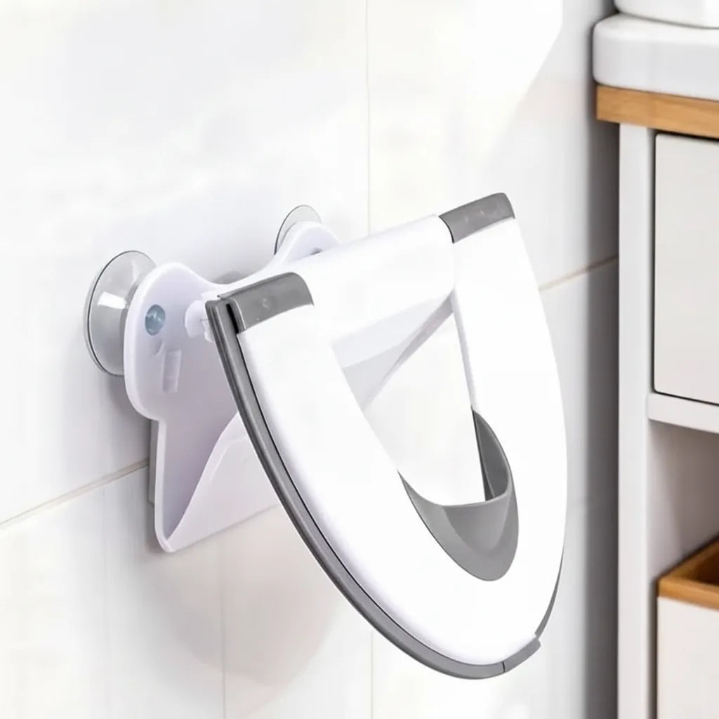 Children's toilet seat with splash guard