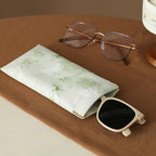 Self-closing glasses case with soft microfiber lining