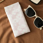 Self-closing glasses case with soft microfiber lining