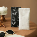 Self-closing glasses case with soft microfiber lining