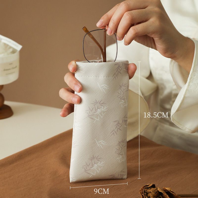 Self-closing glasses case with soft microfiber lining