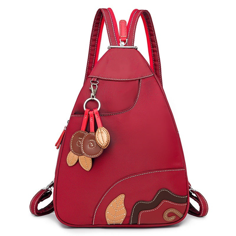 Damenrucksack aus Nylon – Vielseitig tragbar mit Blumenanhänger