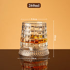 Rotating whisky glass with embossed crystal pattern