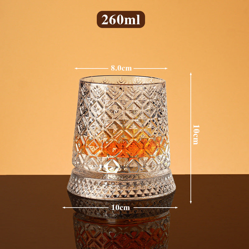 Rotating whisky glass with embossed crystal pattern