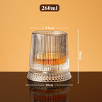 Rotating whisky glass with embossed crystal pattern