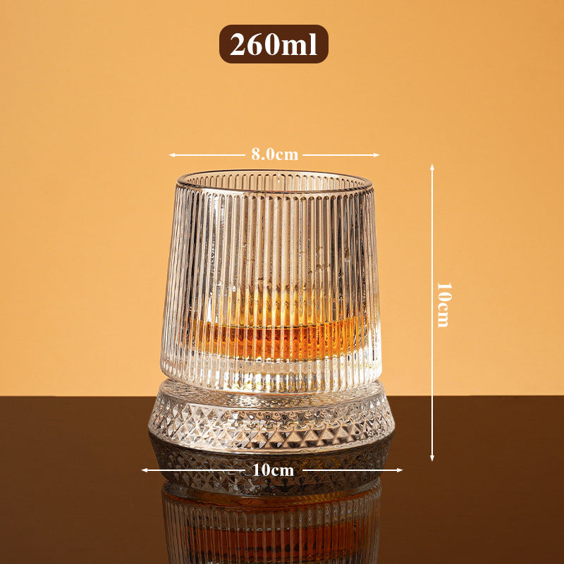 Rotating whisky glass with embossed crystal pattern