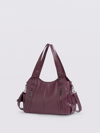 Handtasche mit Reißverschlusstaschen und abnehmbarem Trageriemen